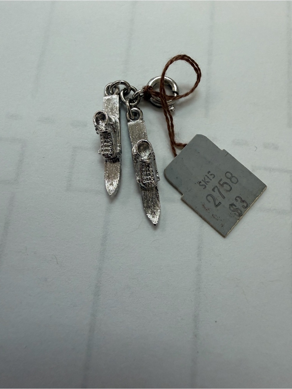 Silver Money Skis charm